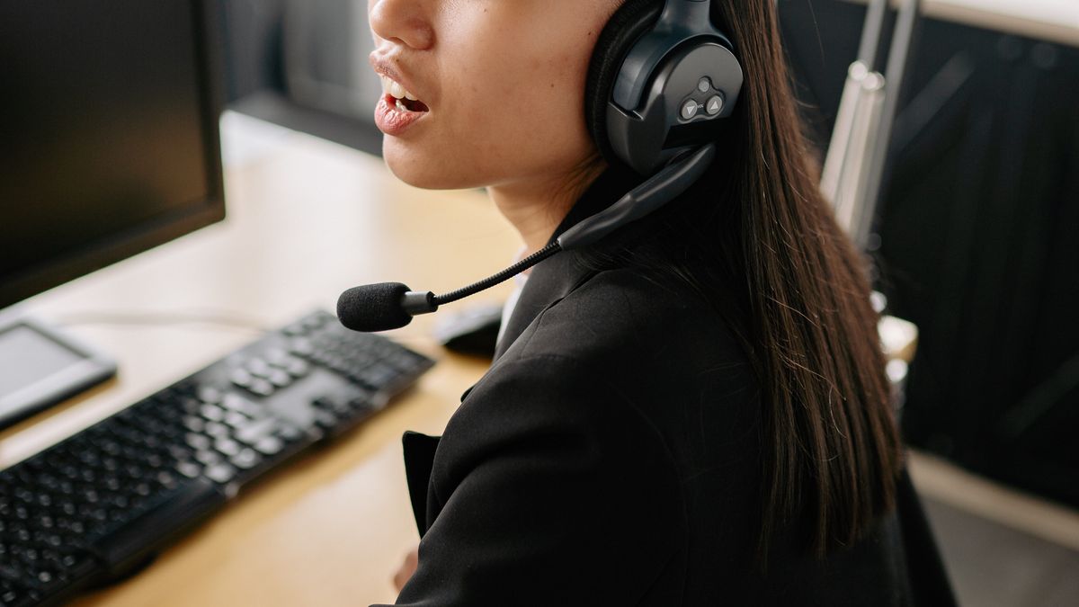 Support agent with headset helping a customer