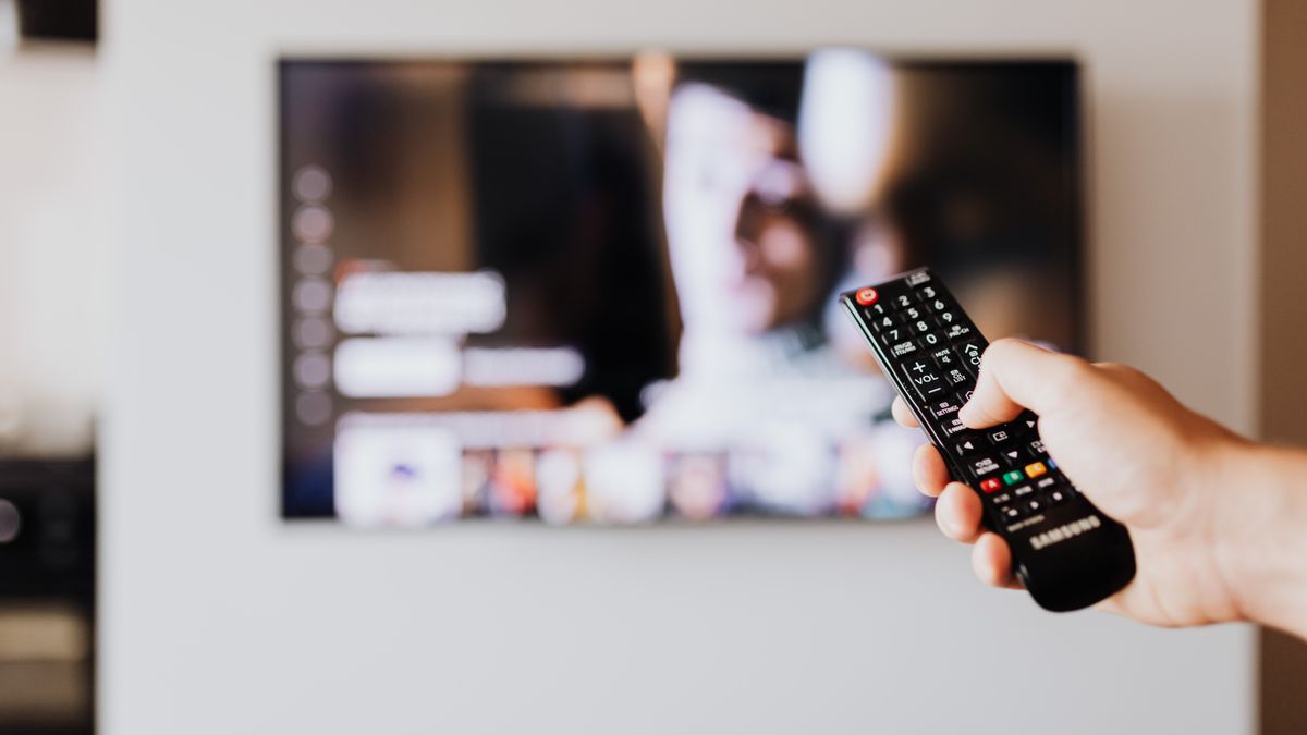 TV remote and streaming player on a television